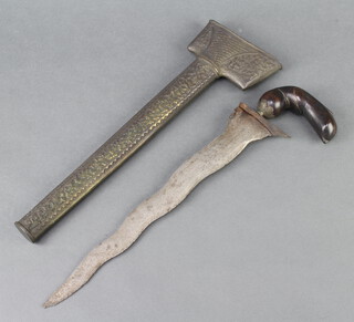 A Kris with 33cm blade (some corrosion and pitting to the blade), contained in an embossed scabbard 