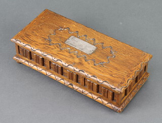 A Tallent wooden musical box with hinged lid 5cm h x 23cm w x 10cm, raised on bun feet 