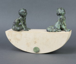 A limited edition stone and bronze sculpture in the form of 2 bronze children sitting on a crescent shaped stone seesaw marked AB 7/25 14cm h x 27cm w x 6cm d  