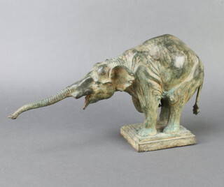 A bronze figure of a standing elephant raised on a square base 22cm h x 39cm w x 10cm d 