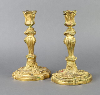 A pair of 19th Century gilt bronze Rococo style candlesticks 25cm h x 14cm 