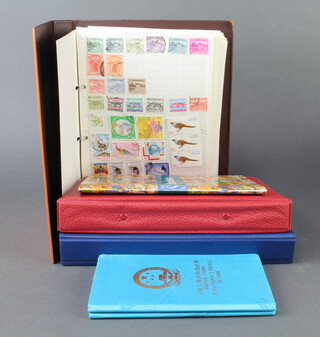 Three ring bound albums of world stamps including New Zealand, Malta, Kenya, Israel, Hungary, Holland, Greece, France, Pakistan, USA, Sri Lanka, together with a collection of loose stamps
