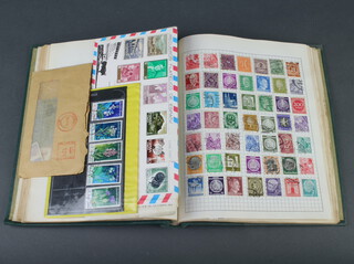 A green Stanley Gibbons Swiftsure stamp album of used stamps GB Victoria to Elizabeth II, New Zealand, Hungary, Germany
