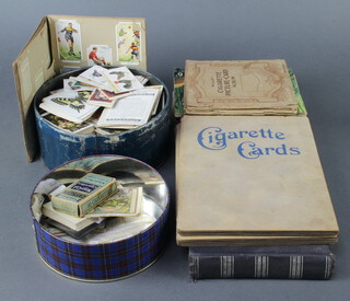 Two albums of cigarette cards including Players, 3 Players cigarette card albums - Aircraft of the Royal Air Force, Kings and Queens of England, British Freshwater Fish, 3 Wills albums - Dogs, Wild Flowers, Our King and Queen, 3 further Wills albums, a Safari teacard album and a Rupert The Bear scrapbook 