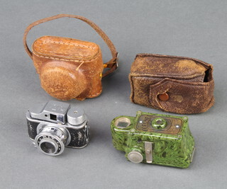 A Coronet midget camera finished in green marble effect and a Japanese Hit miniature camera 
