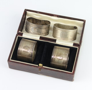 A pair of engine turned silver napkin rings Birmingham 1930, 2 others, 72 grams