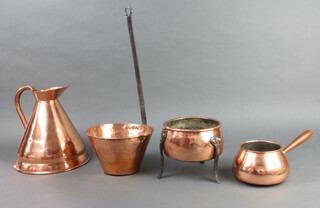 An unmarked waisted copper harvest measure 25cm h x 24cm w, a copper and polished steel ladle 14cm x 20cm, a circular copper and iron pot on 3 outswept supports 15cm x 6cm and a small Portuguese copper saucepan with turned wooden handle 9cm x 10cm 