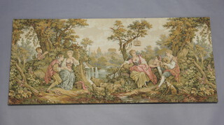 A rectangular machine made tapestry panel with figures by a river and castle in the distance 71cm x 162cm 