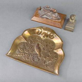 An Art Nouveau embossed brass crumb tray decorated a bird 20cm x 24cm, a gilt metal pen rest decorated a pharaoh 6cm x 7cm x 4cm, a bronzed paperweight in the form of harvest mice on an oak base 7cm x 16cm x 9cm 