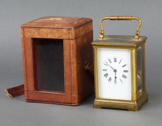 A 19th Century French 8 day striking carriage timepiece with enamelled dial and Roman numerals contained in a gilt metal case 13cm x 9cm x 7cm complete with carrying case and key 