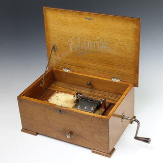 An Edelweiss polyphon with 16 20cm discs, complete with handle, marked 25929, contained in a simulated inlaid walnut box 19cm x 41cm x 48cm 