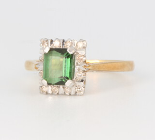An 18ct yellow gold rectangular green tourmaline and diamond cluster ring, the centre stone 0.5ct, the diamonds approx. 0.04ct, 3.5 grams, size J 