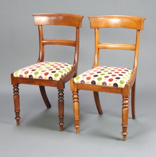 A pair of 19th Century bleached mahogany bar back dining chairs with plain mid rails and upholstered drop in seats, raised on turned supports 86cm h x 46cm w x 43cm d (seat 21cm x 30cm) 