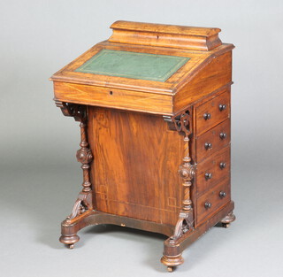 A Victorian inlaid walnut Davenport, the top with stationery box with hinged lid, the pedestal fitted 4 drawers, raised on bun supports 84cm h x 54cm w x 53cm d 
