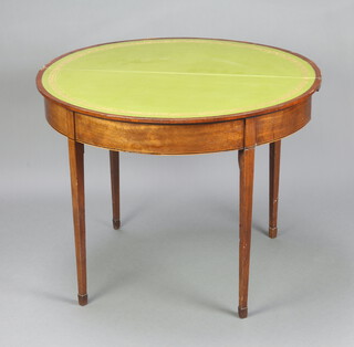 A 19th Century mahogany demi-lune card table with green inset leather playing surface, raised on square tapered supports, brass caps and casters 71cm h x 91cm w x 47cm 