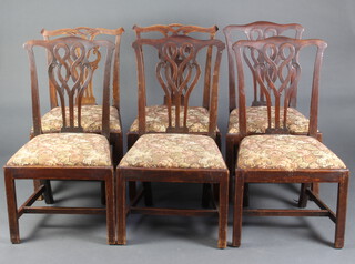 A harlequin set of 6 Chippendale style dining chairs comprising 4 mahogany 97cm h x 54cm w x 44cm (seats 26cm x 28cm) and a pair in oak with pierced vase shaped slat backs 93cm h x 53cm w x 55cm d (seat 30cm x 30cm),  all with upholstered drop in seats, raised on square supports with H framed stretchers 97cm h x 