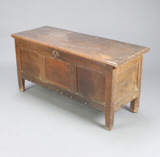 A 17th/18th Century oak coffer of panelled construction, fitted a candle box 55cm h x 114cm w x 46cm d 