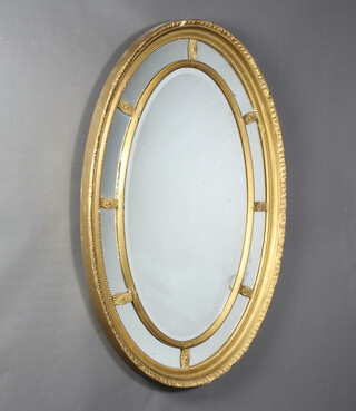 A 19th Century Regency style oval plate mirror contained in a gilt frame 78cm h x 113cm w 
