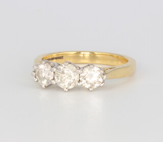 An 18ct yellow gold 3 stone diamond ring, approx. 1ct, 4.1 grams, size L 