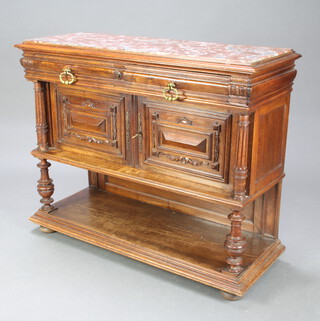 A 19th Century French carved walnut sideboard with pink veined marble top above 2 short drawers, the base enclosed by panelled doors and having an undertier, raised on turned fluted columns 94cm h x 116cm w x 44cm d 