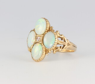 A 9ct yellow gold 4 stone opal and diamond ring 3.3 grams, size M