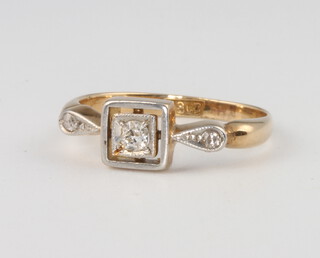 An 18ct yellow gold single stone diamond ring approx. 0.10ct (chipped) flanked by diamond chips, 2.3 grams, size J 