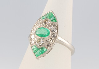 A platinum Art Deco style marquis emerald and diamond ring, the 11 emeralds approx. 0.75ct, brilliant cut diamonds 0.85ct, 4.6 grams, size M 