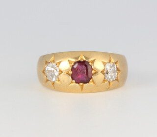 A yellow metal ruby and diamond ring, the centre ruby approx. 0.40ct, the 2 brilliant cut diamonds approx. 0.4ct, size K, 4.9 grams 