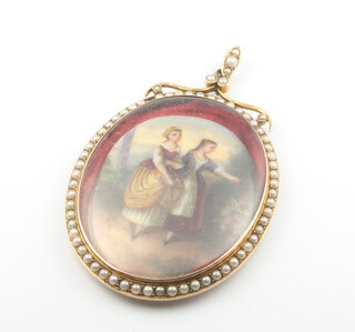 A 9ct yellow gold pendant set with seed pearls, now containing a painted porcelain plaque depicting 2 ladies 7.5cm