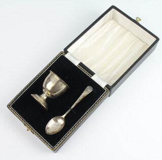 A silver egg, cup and spoon, cased Birmingham 1962, 38 grams 