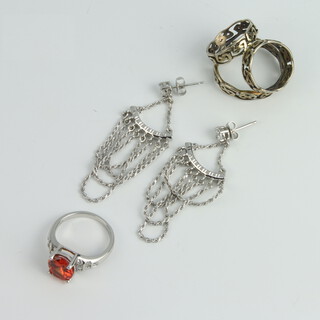 A silver scarf ring, dress ring and pair of earrings