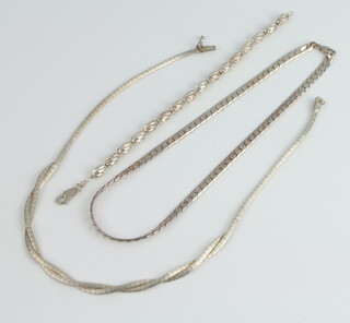 Two silver necklaces and a silver bracelet 54 grams 
