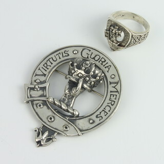 A Sterling silver Robertson Clan kilt brooch together with a ditto ring 37.9 grams