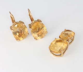 A 14ct yellow gold citrine pendant and ditto ear clips 
