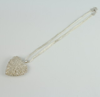 A silver mesh heart pendant and chain 16.5 grams 