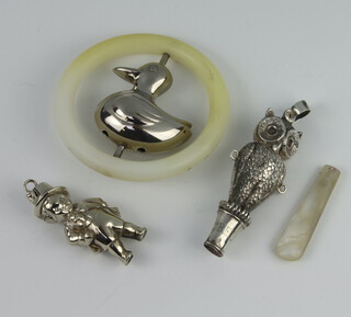 A repousse silver owl whistle (ex rattle) Birmingham 1925 together with two plated ditto 
