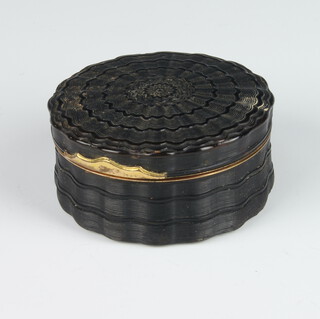 A good 19th Century circular turned tortoiseshell snuff box with gilt metal mounts, the lid interior enclosing an oval portrait of a lady 7cm 