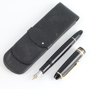 A gentleman's Mont Blanc fountain pen with 14ct gold nib, 14.5cm, contained in a leather Mont Blanc pouch