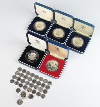 Three commemorative silver proof coins 1981, a 1977 ditto, a 50 pence piece, a one pound coin (all silver) 134 grams and a small quantity of pre-1947 threepences 