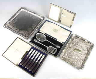 An Edwardian engraved silver plated tray decorated with flowers 30cm, 2 cased sets, 2 frames and a repousse tray 