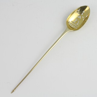 A Georgian silver mote spoon, gilded with rubbed marks 