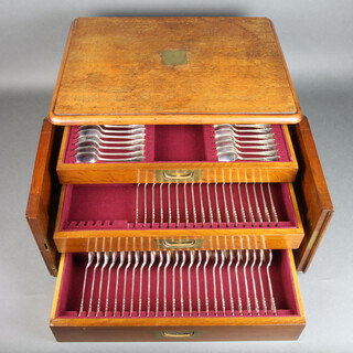 A matched canteen of silver lily pattern cutlery comprising 12 Victorian teaspoons London 1891, 18 grapefruit spoons 925 standard, 18 sundae spoons 925 standard and 24 soup spoons 925 standard, total 3878 grams, contained in a mahogany 3 drawer canteen  