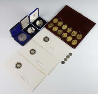 A cased set of silver gilt medallions - The Arms of The Prince and Princess of Wales, 3 cased silver medallions and 3 others, 298 grams