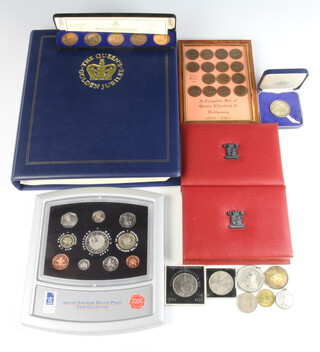 A collection of uncirculated sets (3) and minor commemorative coins and medallions 
