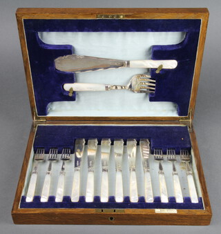 A cased set of silver and mother of pearl fish eaters and servers for 6, Sheffield 1930, contained in a mahogany canteen 