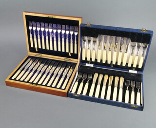 A cased set of Edwardian fish eaters for 12, contained in a mahogany canteen together with a cased set of plated fish eaters for 12 with fancy handles 