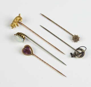 An Edwardian yellow metal tie pin in the form of a pig with ruby eyes, 4 other tie pins