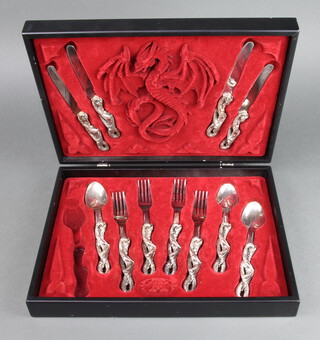 A set of steel cutlery with dragon handles comprising 4 dinner knives, 4 dinner forks and 3 spoons 