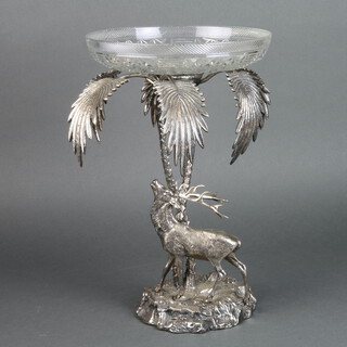 A Valenty silver plated centre piece with deer beneath palm trees having a cut glass bowl 42cm