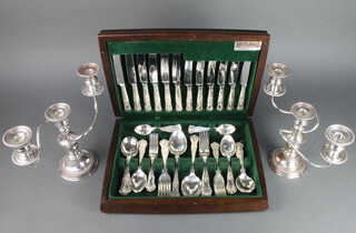 A pair of silver plated 3 light candelabra together with a canteen of plated Kings pattern cutlery for 6 